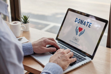 Person on laptop looking at donation screen