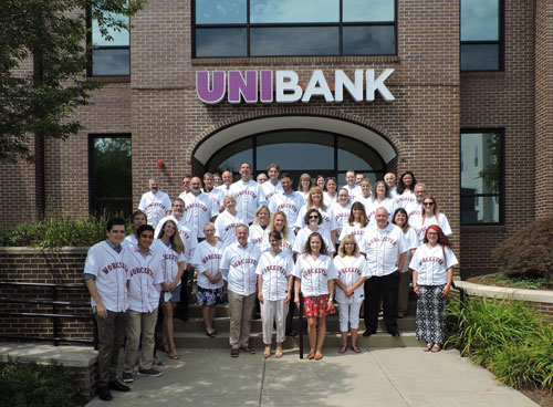 UniBank staff in WooSox jerseys